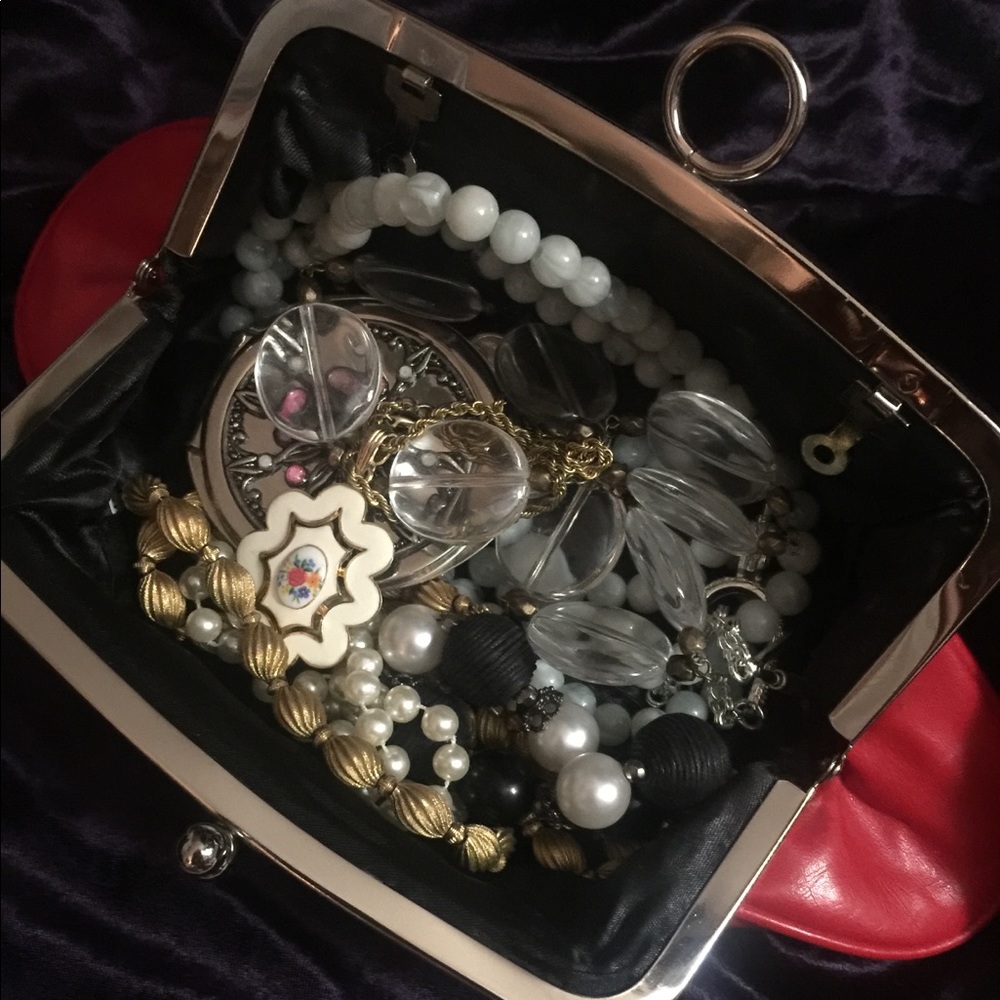 Purse filled with vintage costume jewelry